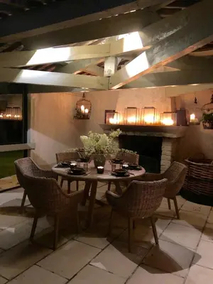 a dining room with a table and chairs and a fireplace at FOUR DE CONY in Saumane-de-Vaucluse