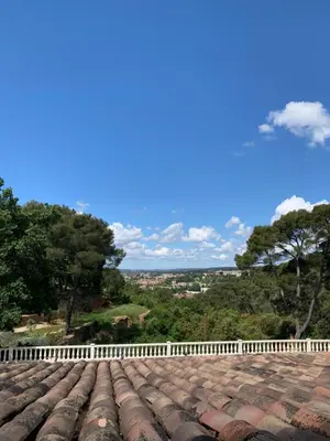 a view from the roof of a house with a white fence at La Farigoule - Sainte-Victoire - Vue exceptionnelle sur Aix-en-Provence in Aix-en-Provence