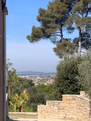 a stone wall with a tree in the background at La Farigoule - Sainte-Victoire - Vue exceptionnelle sur Aix-en-Provence in Aix-en-Provence