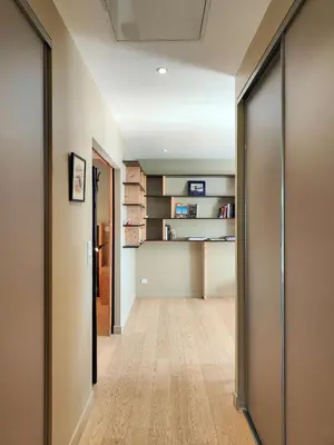 a hallway with a door leading into a room at Hostellerie Le Paradou in Lourmarin