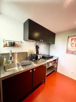 a kitchen with a sink and a counter top at Loft 52 in Aix-en-Provence