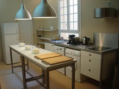 a kitchen with a table with cups on it at L'Appart 6 in Aix-en-Provence