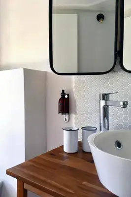a bathroom with a sink and a mirror at Domaine de Carraire in Aix-en-Provence