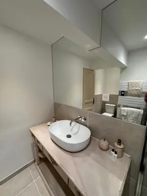 a bathroom with a sink and a mirror at Le Clos de Manon in Gordes
