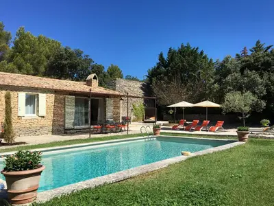 a swimming pool in the yard of a house at Le Clos de Manon in Gordes