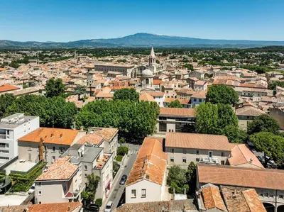 an aerial view of a city with buildings at Urban Style Hotel Blason du Ventoux in Carpentras