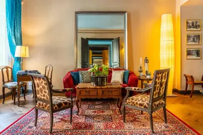 a living room with a couch and a table at La Maison d'été in Salon-de-Provence