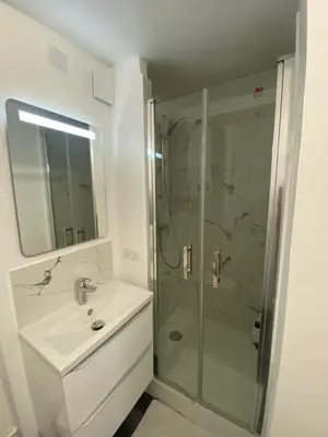a bathroom with a sink and a shower at L'Escapade Aixoise hyper centre historique studios free netfilx wifi romantics apartments historic center in Aix-en-Provence