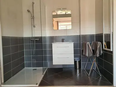 a bathroom with a shower and a sink at la réveuse in Gordes