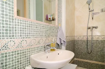 a bathroom with a sink and a shower at Domaine du Castel in Aix-en-Provence