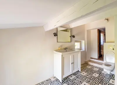 a bathroom with a sink and a toilet at Villa spacieuse avec jardin à Saignon in Saignon