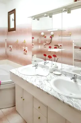 a bathroom with two sinks and a large mirror at Villa spacieuse à Lioux avec piscine privée et vue montagne in Lioux