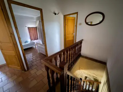 a staircase leading to a room with a mirror at Bastide du Buou in Puyvert