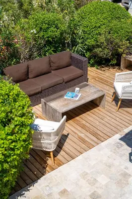 a patio with a couch and a table and chairs at Mas OREA in Gordes