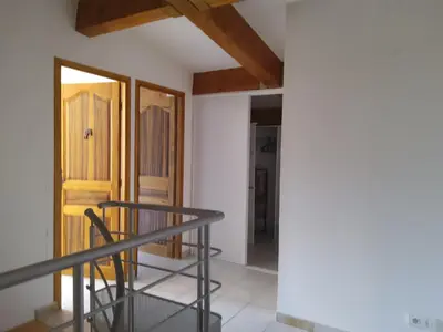 a room with a staircase and a wooden door at Domaine de la Marie dans le Luberon in Peypin-dʼAigues