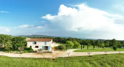 a house in the middle of a field at Domaine de la Marie dans le Luberon in Peypin-dʼAigues