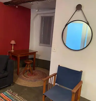 a kitchen with a table and chairs and a stove at Charmante maison en centre ville d'Apt in Apt