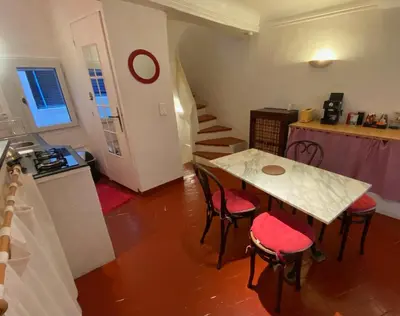 a living room with a couch and a table at Charmante maison en centre ville d'Apt in Apt