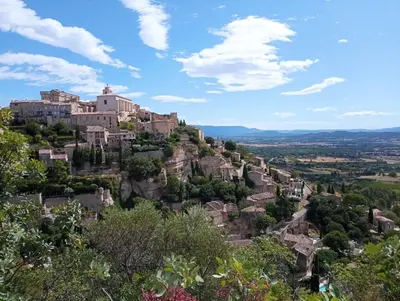 a village on top of a mountain at A 5 Minutes des Ocres Gïte La Charite Gordes Roussillon in Gargas