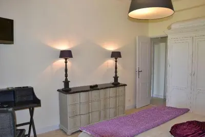 a room with a purple rug in a room with a piano at Mas Le 7 in Saint-Andiol