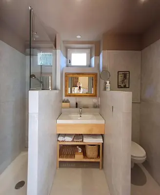 a bathroom with a sink and a toilet and a mirror at Le Mas de la Sorgue in Le Thor