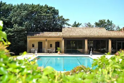 a house with a swimming pool in front of it at Best Western Domaine de Roquerousse in Salon-de-Provence