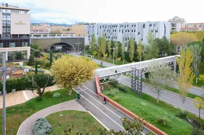 a bridge over a road in a city with buildings at T2 cosy proche du centre-ville avec garage inclus in Aix-en-Provence