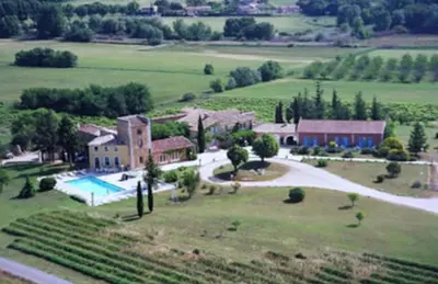 an aerial view of a house with a swimming pool at Mas De La Tour in Gargas