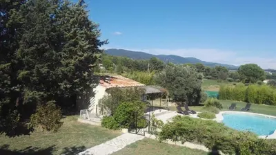 an aerial view of a house with a swimming pool at Le Samaro in Puyvert