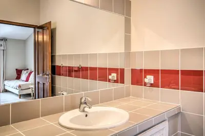 a bathroom with a sink and a mirror at Mas Santoline in Eygalières