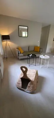 a living room with a couch and a table at Gîte Charmant avec Piscine et Terrasse en Provence MDV in Carpentras