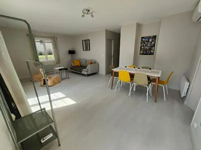 a living room with a dining room table and chairs at Gîte Charmant avec Piscine et Terrasse en Provence MDV in Carpentras