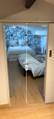 a bedroom with two beds in a room at Centre d'énergies in Monteux