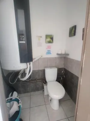 a small bathroom with a toilet and a phone at Gîte du Charme Provençal in Sénas