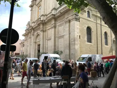 a group of people standing in front of a building at La Magnanerie in LʼIsle-sur-la-Sorgue