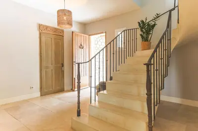 a staircase in a home with a potted plant at Mas Carla in Noves