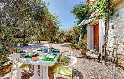 a white table and chairs on a patio at 2 Bedroom Gorgeous Apartment In Caromb in Caromb