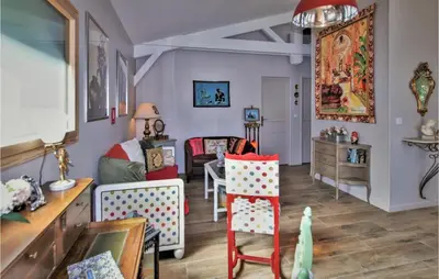 a living room with a couch and a table at Stunning Home In Saignon in Saignon