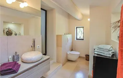 a bathroom with a sink and a toilet in it at 4 Bedroom Stunning Home In Lagnes in Lagnes