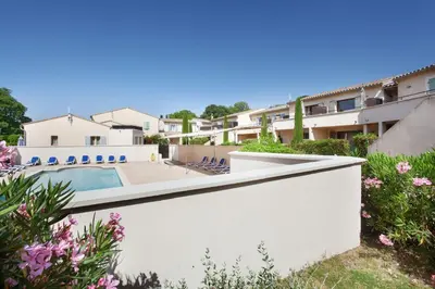 a view of a villa with a swimming pool at Résidence Odalys Les Soleils du Luberon in Bonnieux