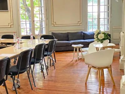 a bedroom with a large bed and a mirror at Hôtel de France in Aix-en-Provence