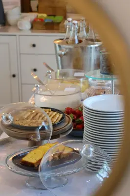 a table with plates of food on a counter at Logis Hotel Le Blason de Provence in Monteux