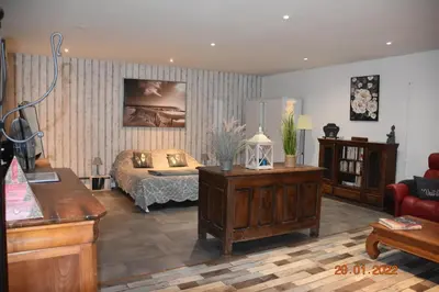 a living room with a bed and a couch at Villa Lumières in Goult
