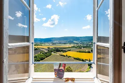 an open window with a view of the countryside at Le Nesk Ventoux - Hotel in Sault-de-Vaucluse