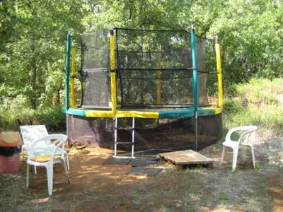 a childrens play area with a trampoline at Gite des Ocres in Villars