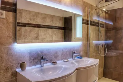 a bathroom with a sink and a mirror at Villa piscine face au grand luberon Cereste in Céreste