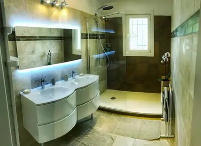 a bathroom with a sink and a shower at Villa piscine face au grand luberon Cereste in Céreste