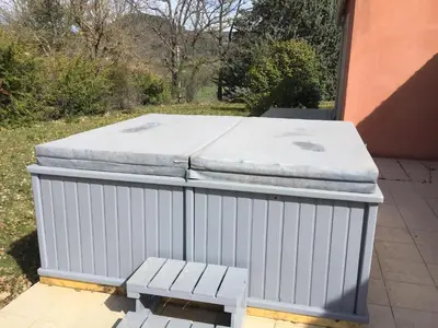 two mattresses stacked on top of each other on a patio at Villa piscine face au grand luberon Cereste in Céreste