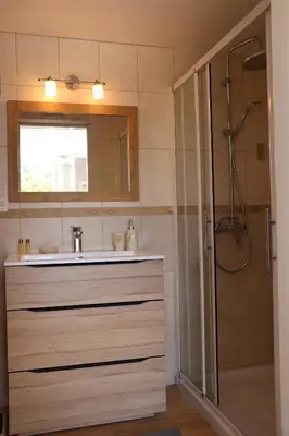 a bathroom with a sink and a shower at IA ORANA in Gargas