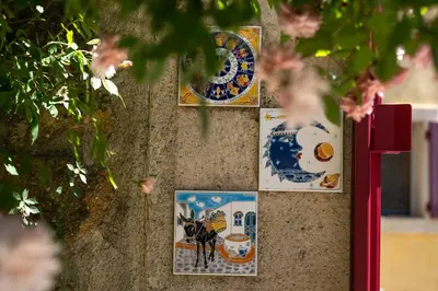 a wall with pictures of a dog on it at Une Chambre en Luberon in Puyvert